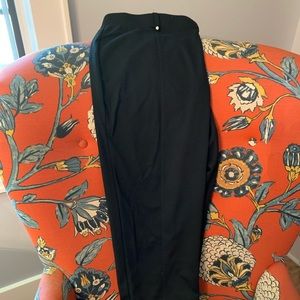 Black pants with crystals on front belt loops